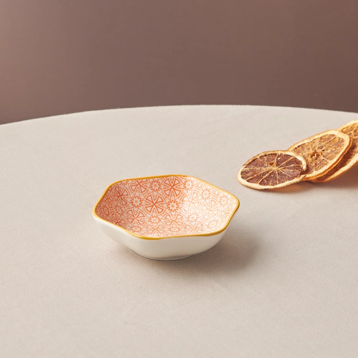 Karaca Floral Orange Hexagon Snack Plate, 10 cm, decorative ceramic bowl with orange floral pattern and geometric shape.