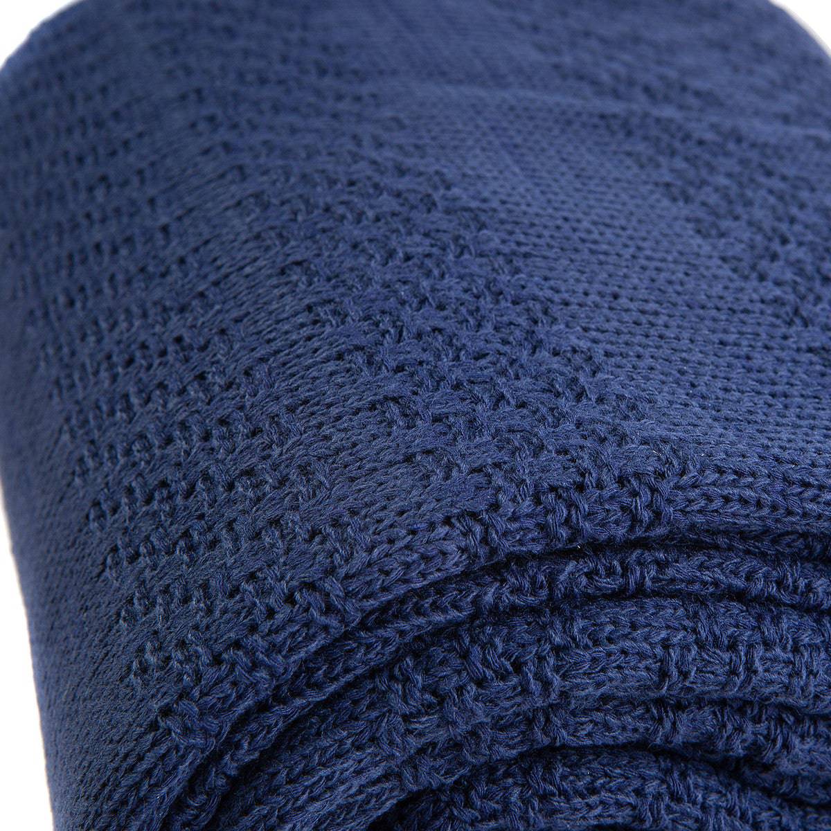Navy blue Karaca Home Charm Bold double knit blanket spread out, showcasing its soft, cozy texture and stylish design.