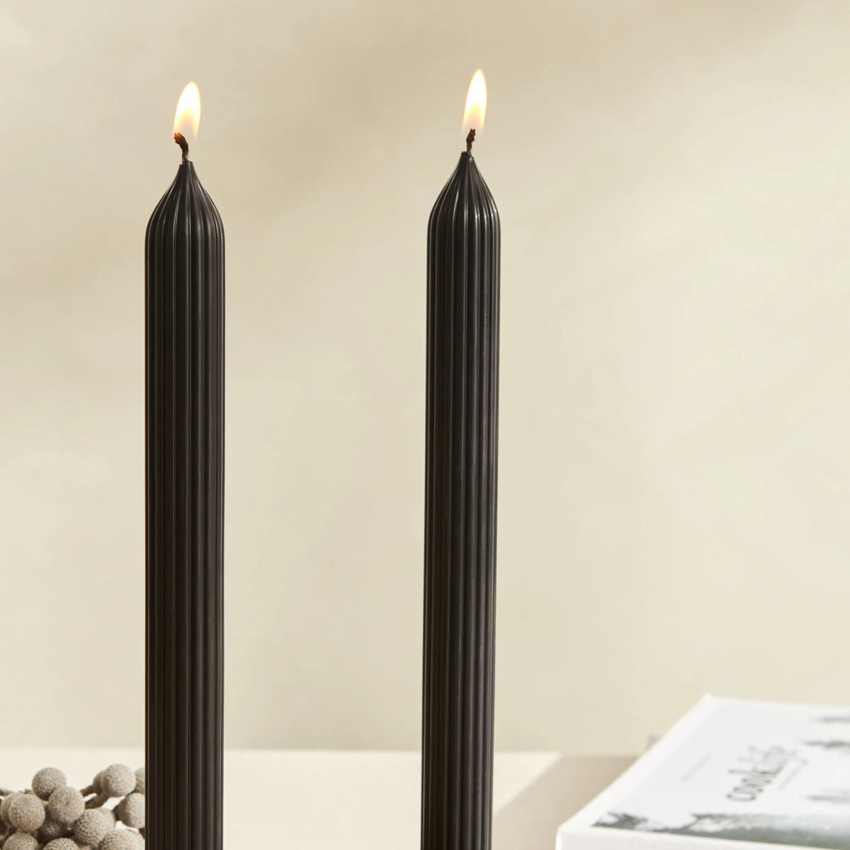 Two black Karaca Home Wave candlestick candles, 2-piece set, with sleek modern design, ideal for home decor or special occasions.