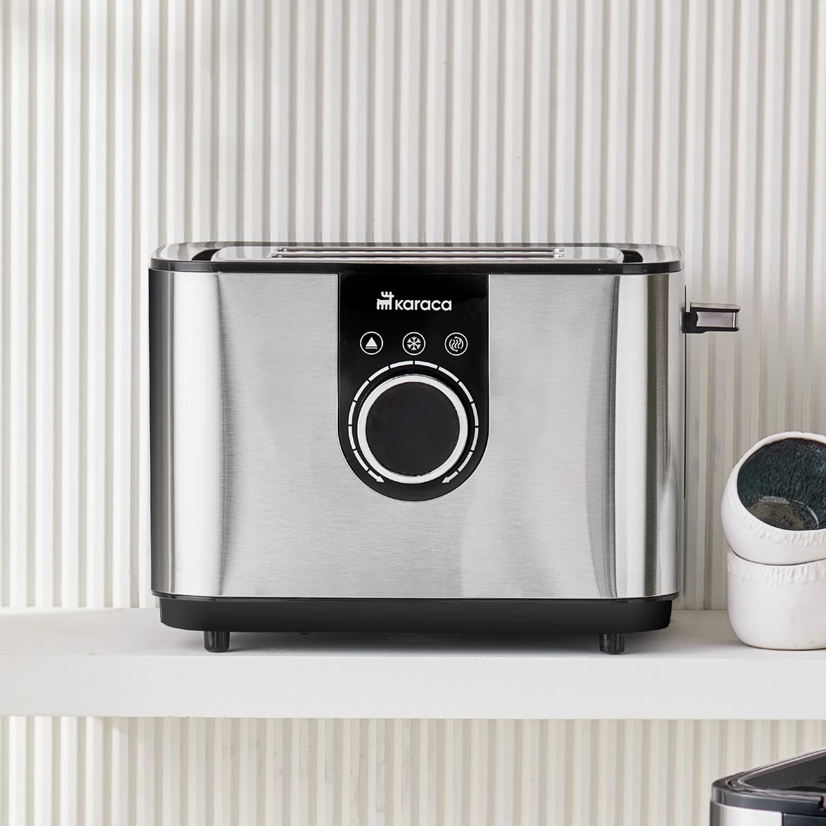 Karaca Inox Toaster 2303 kitchen appliance with stainless steel finish, featuring wide slots for bread and modern design.