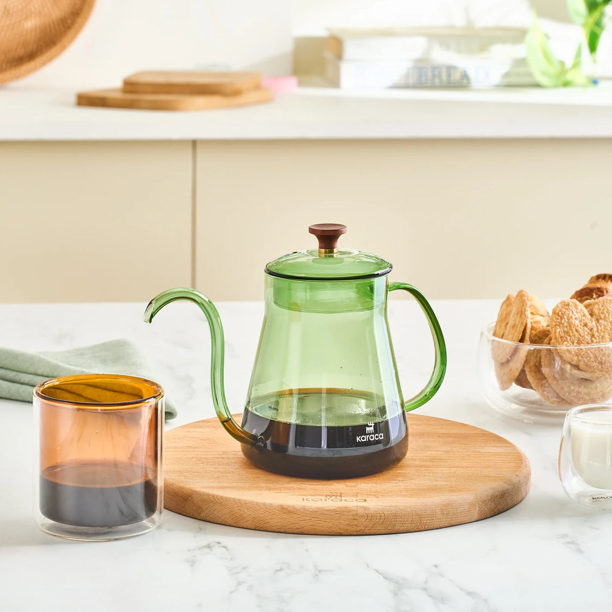 Karaca Martina green borosilicate glass coffee kettle with 600 ml capacity, showing a sleek, modern design for brewing hot beverages.