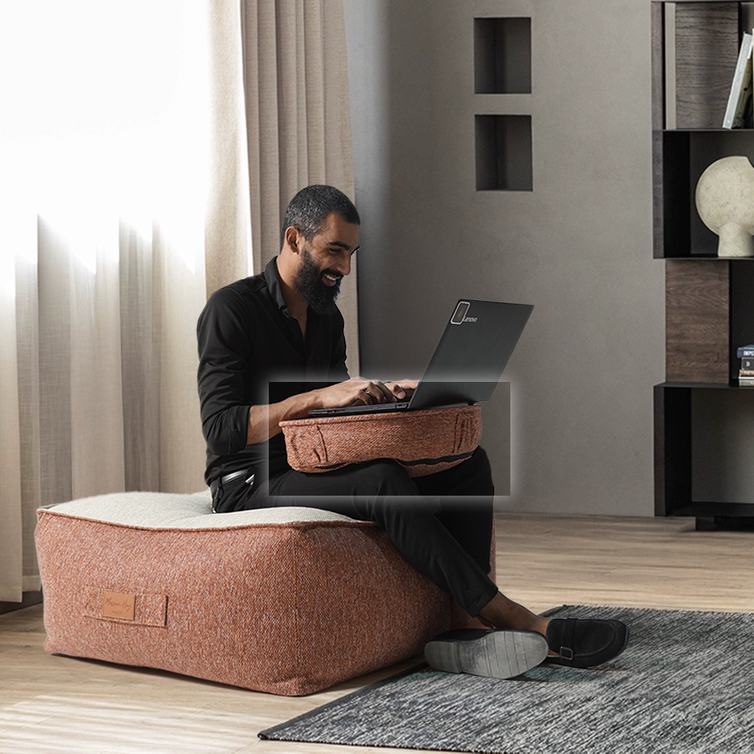 La Concha Pouf by BEACON, round beige and gold fabric ottoman with textured design for living room decor.