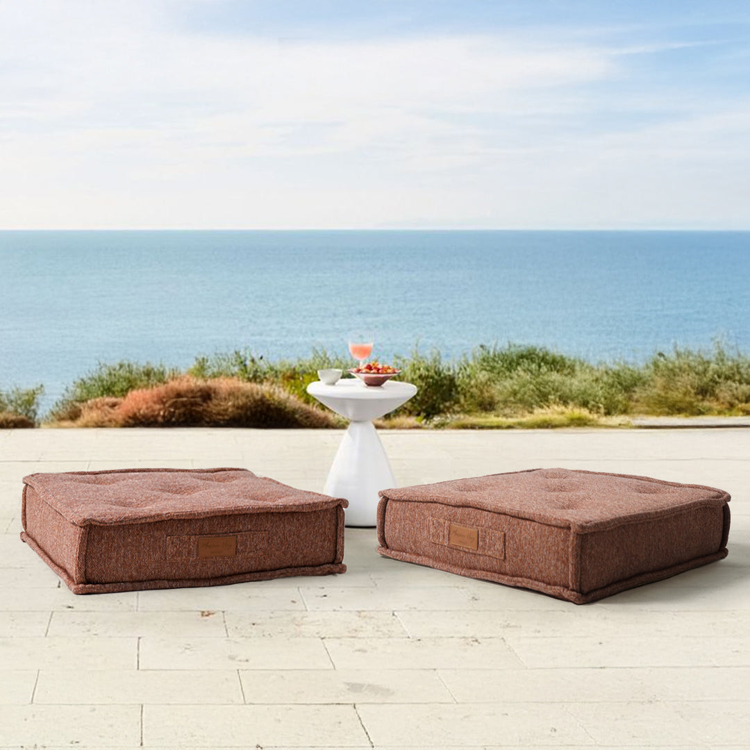 Orange La Concha pouf by BEACON with compressed foam, round shape, soft fabric upholstery, suitable for living room or lounge.