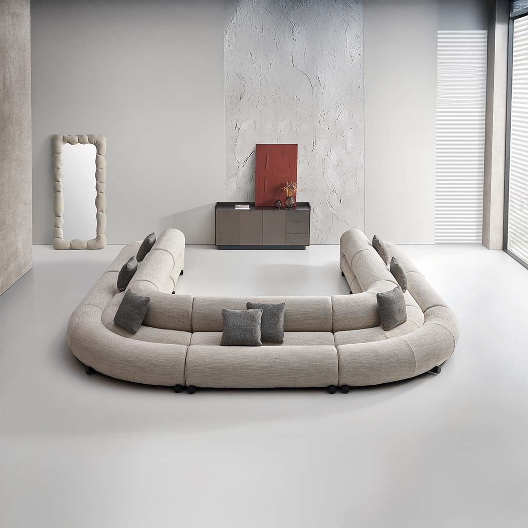 Laisi 90-degree corner module sofa with long back by BEACON, featuring modern design and comfortable seating in a living room setting.