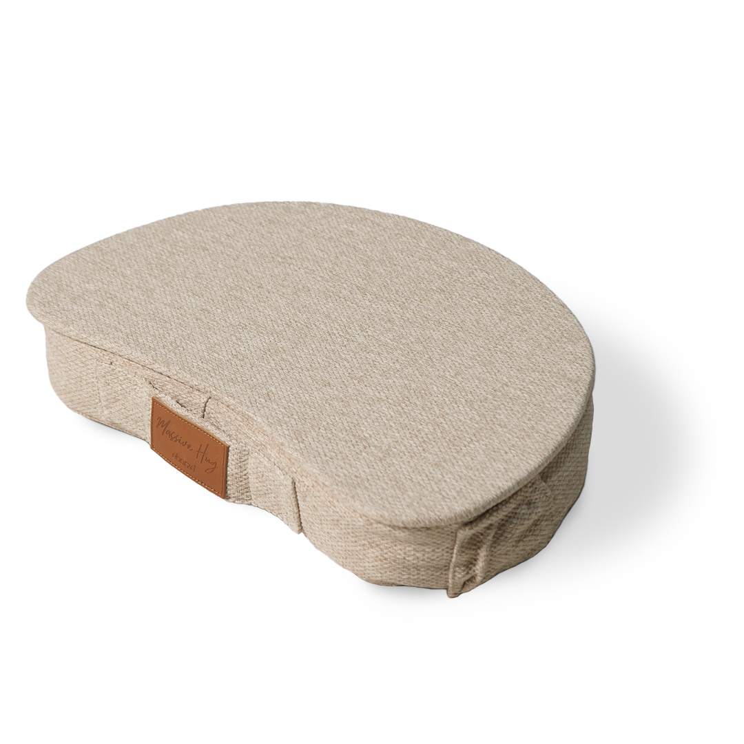 Beige Lazy Lap Pouf by BEACON, soft fabric seat with a cozy, cushioned design perfect for lounging or casual seating.