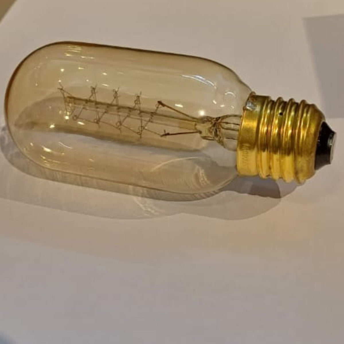 BEACON vintage Edison LED bulb E27 T45 amber 40W bulb with classic Edison filament and warm amber glow.