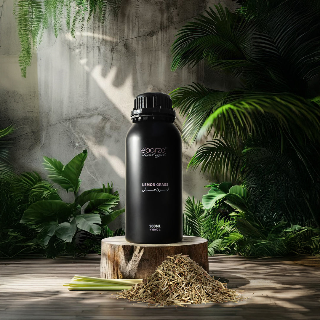 Bottle of BEACON Lemon Grass Essential Oil in a 500ml dark glass bottle, with fresh lemon grass stalks beside it.