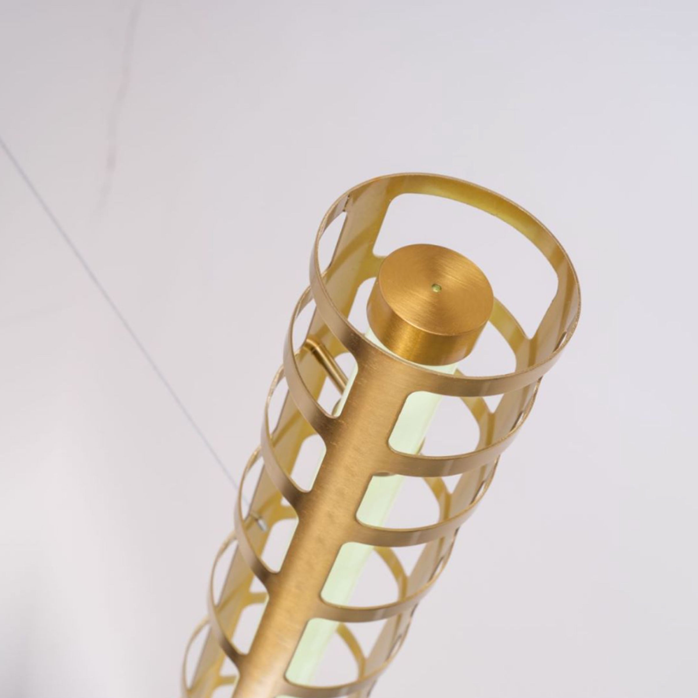Luminous Thread Pendant Lamp by BEACON in gold with intricate thread design hanging as a stylish pendant light.