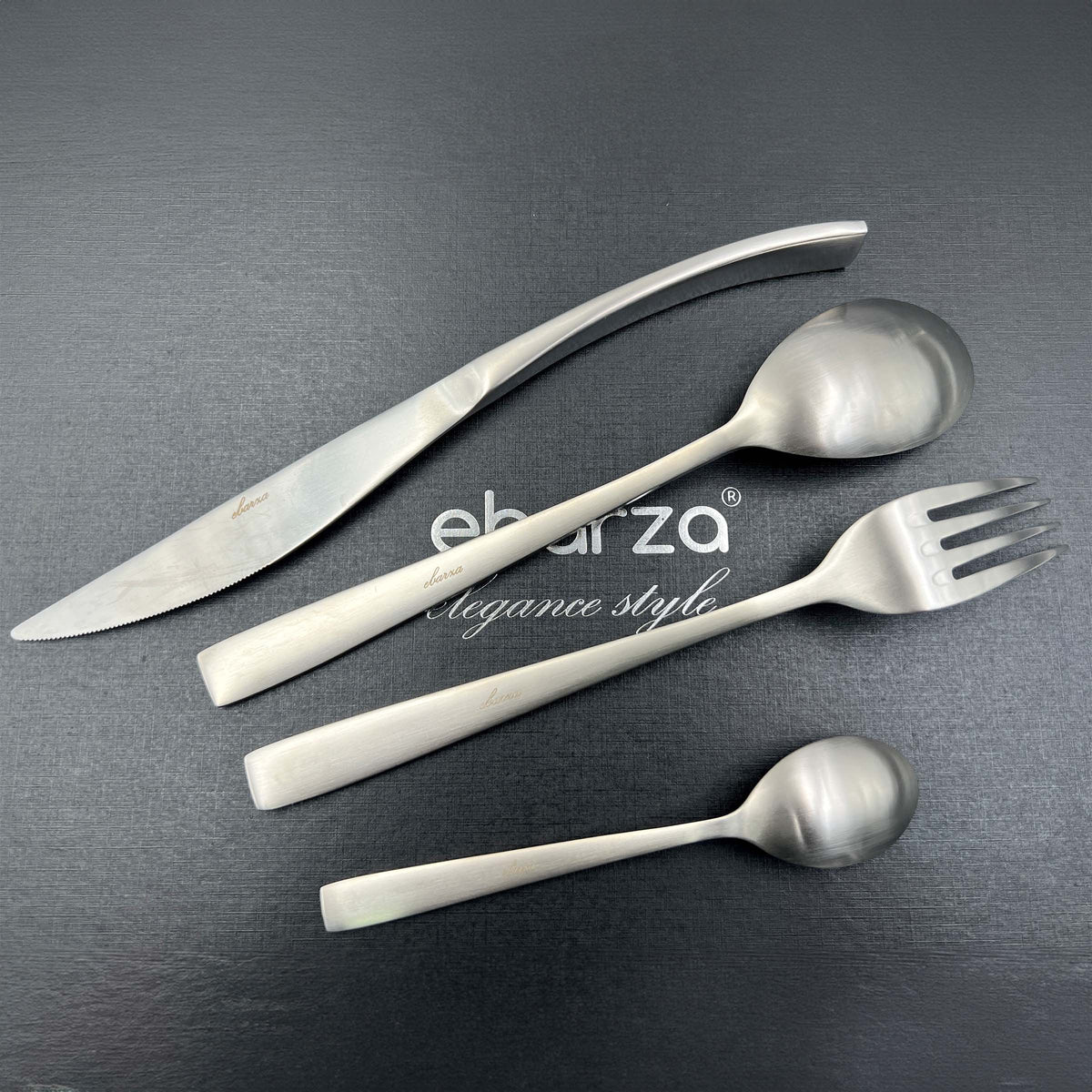 BEACON Metro Chic 24-piece matte silver cutlery set includes forks, knives, spoons, and teaspoons for elegant dining.