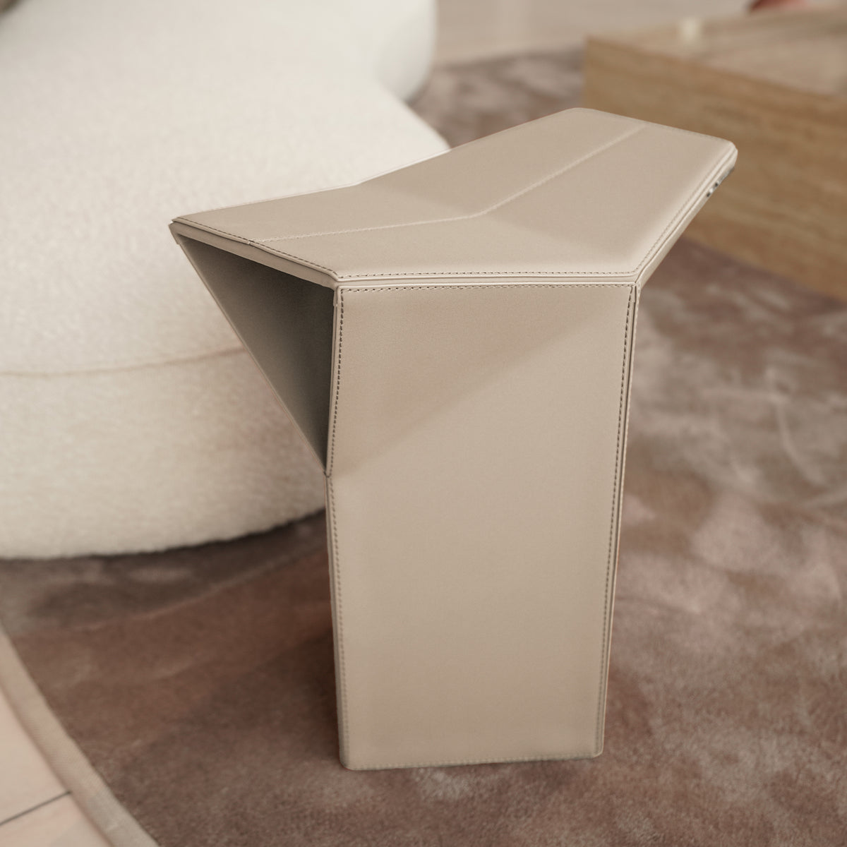 Beige microfiber saddle leather pouf side table and low stool by BEACON, JK-D161, versatile furniture for living spaces.