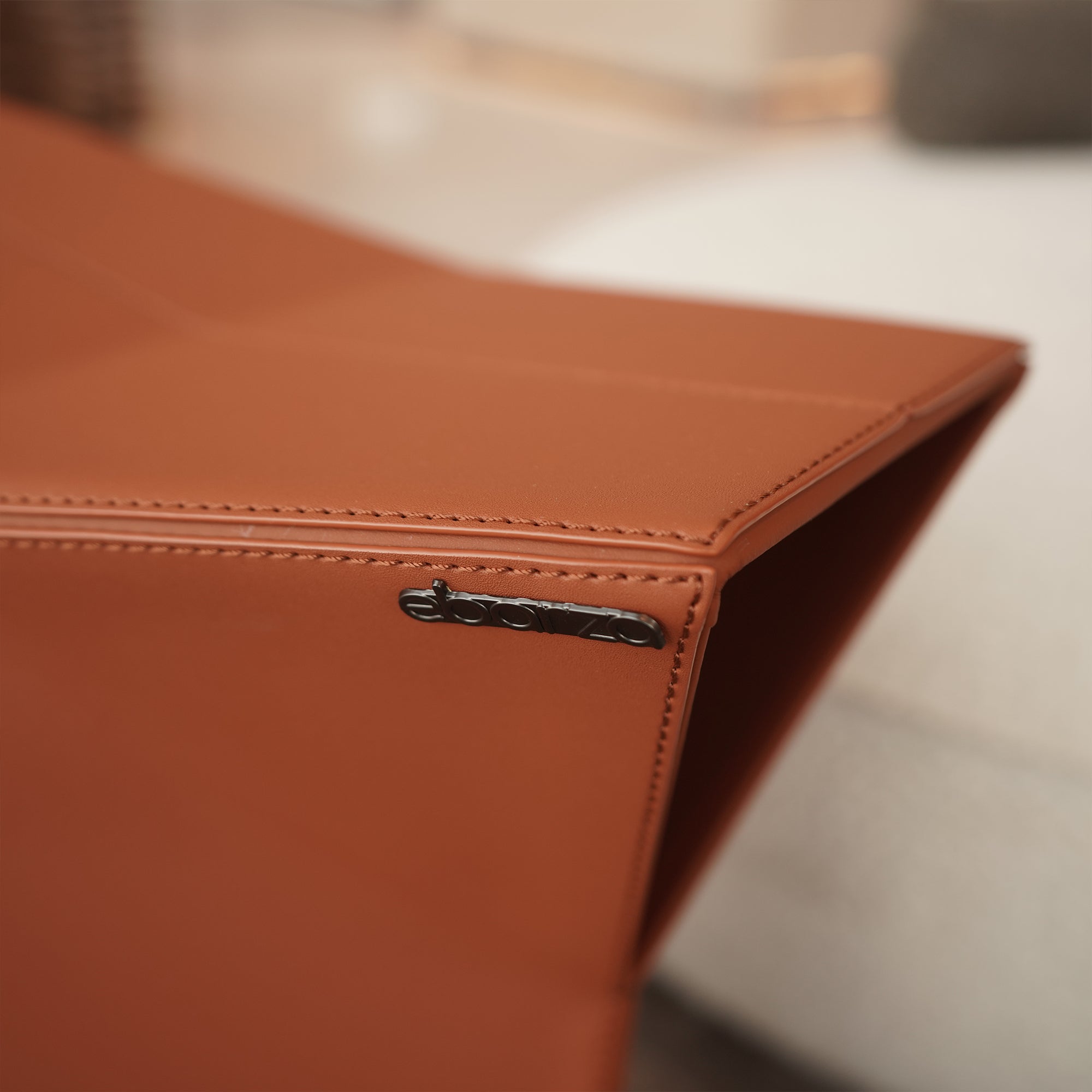 Orange microfiber saddle leather pouf, low side table or stool by BEACON, model JK-D161, versatile and stylish for living spaces.