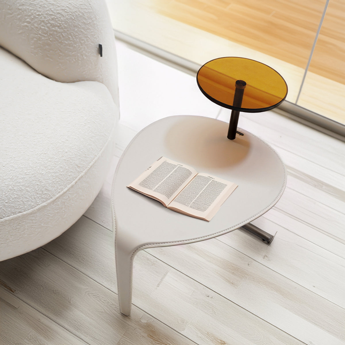 Modern nesting side tables by BEACON, sleek design with overlapping surfaces, ideal for living room or bedroom decor.