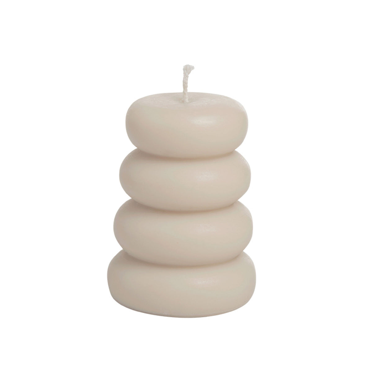 White multi-layer candle by BEACON, showcasing its stacked design and elegant appearance for decorative or ambient use.