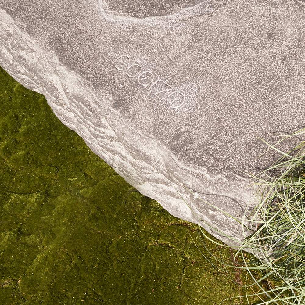 Natural stone bench by BEACON, 21-4082A, featuring smooth, polished surface and sturdy construction for outdoor or indoor use.