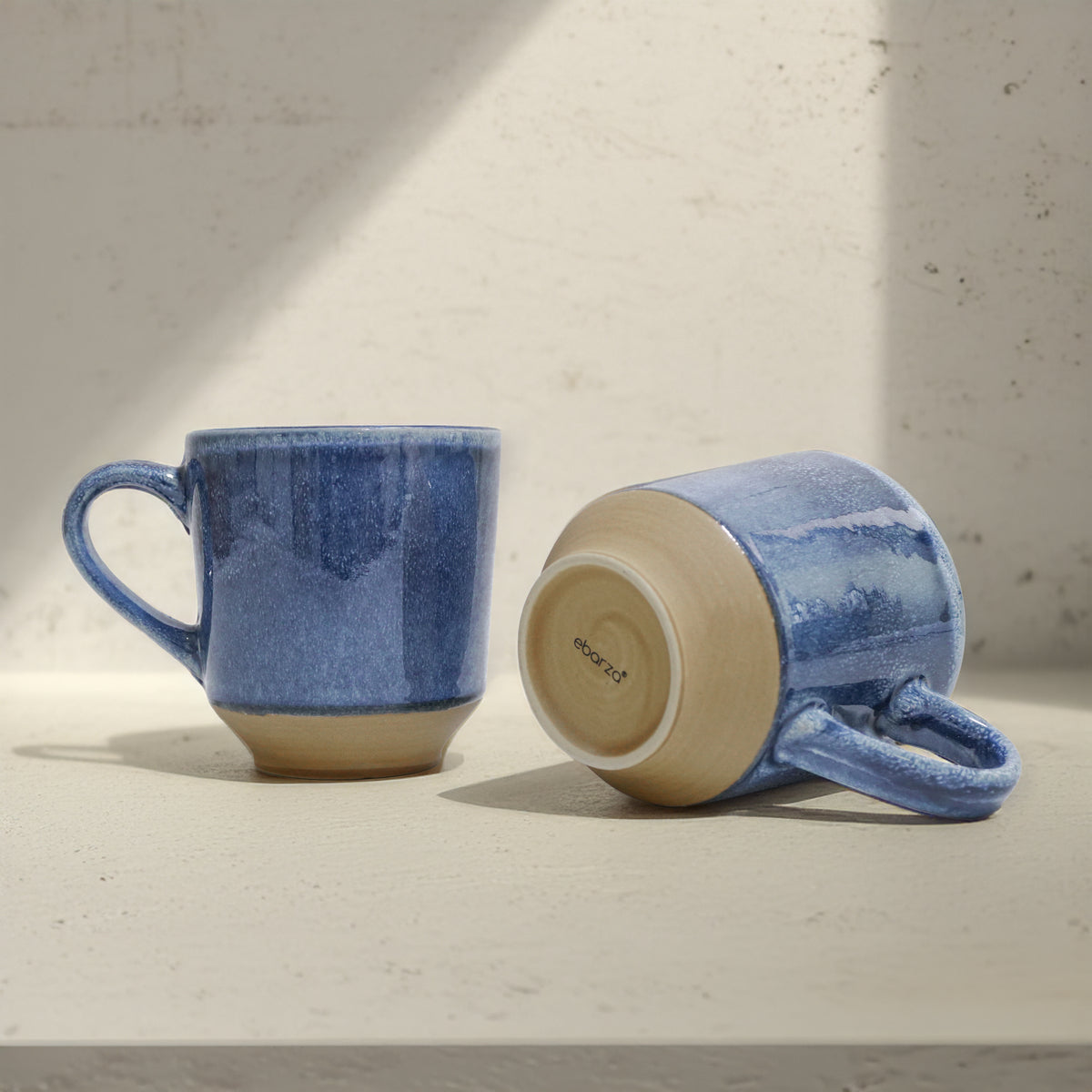 Navy blue ceramic mug with BEACON branding and handle, perfect for hot beverages, shown on a plain background.
