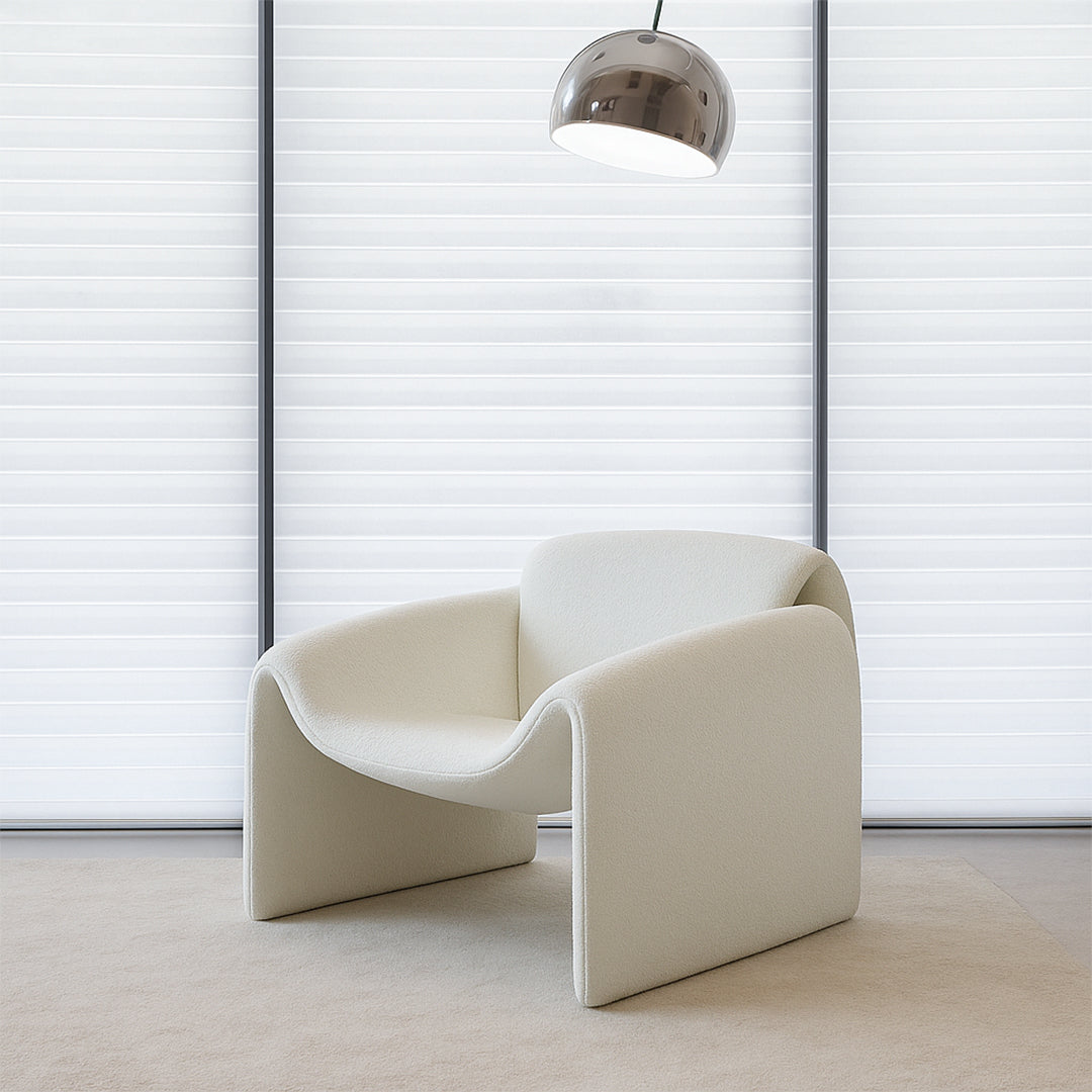 White beige Drancy armchair by BEACON with plush fabric and modern design, showcasing the comfortable seating and stylish appearance.