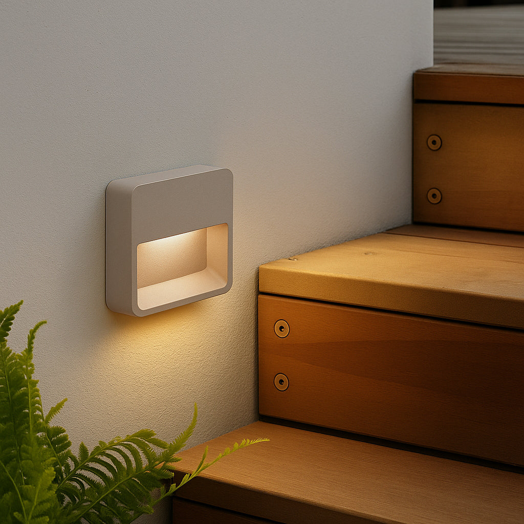 Beacon NightEdge wall lamp in sandy taupe, featuring a sleek, modern design with a curved wall-mounted fixture.