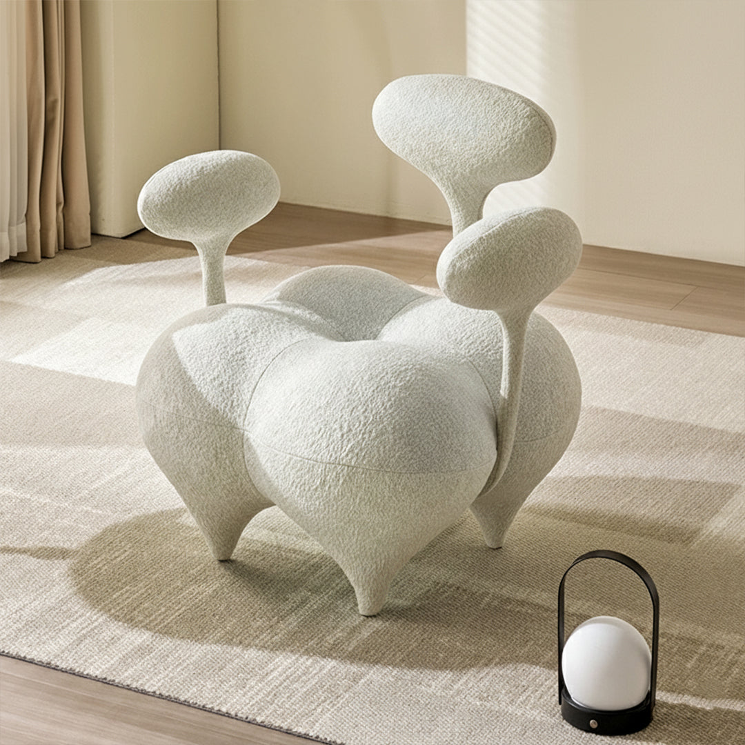 Beige and white Nodus lounge chair by BEACON with sleek modern design and plush cushioned seat for comfortable seating.