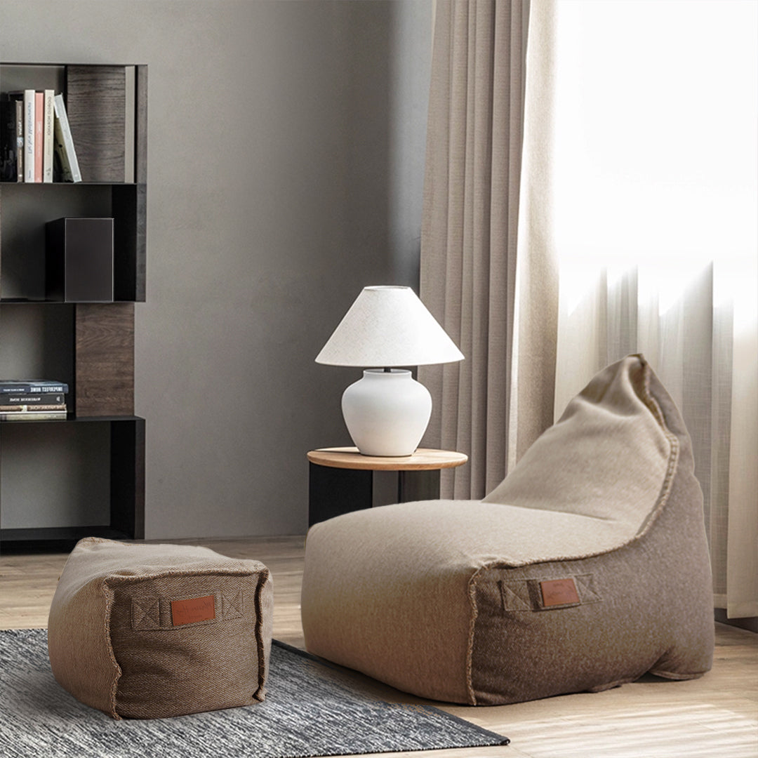 Beige Olefin Sunproof bean bag with matching ottoman by BEACON, featuring a plush, comfortable fabric and modern design.