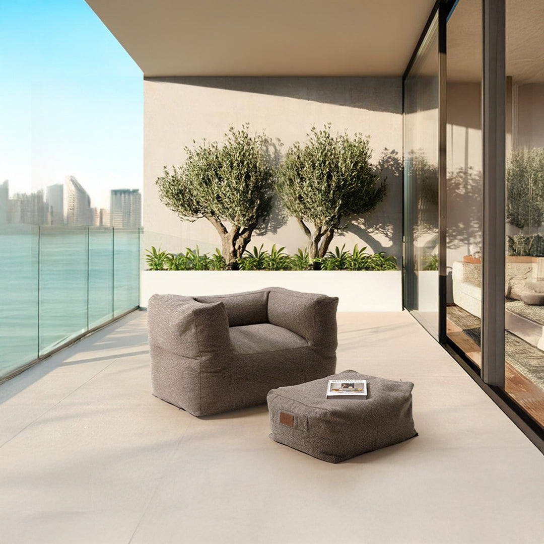 Brown Olefin sunproof bean bag with matching ottoman by BEACON, featuring plush fabric and comfortable design for indoor or outdoor use.