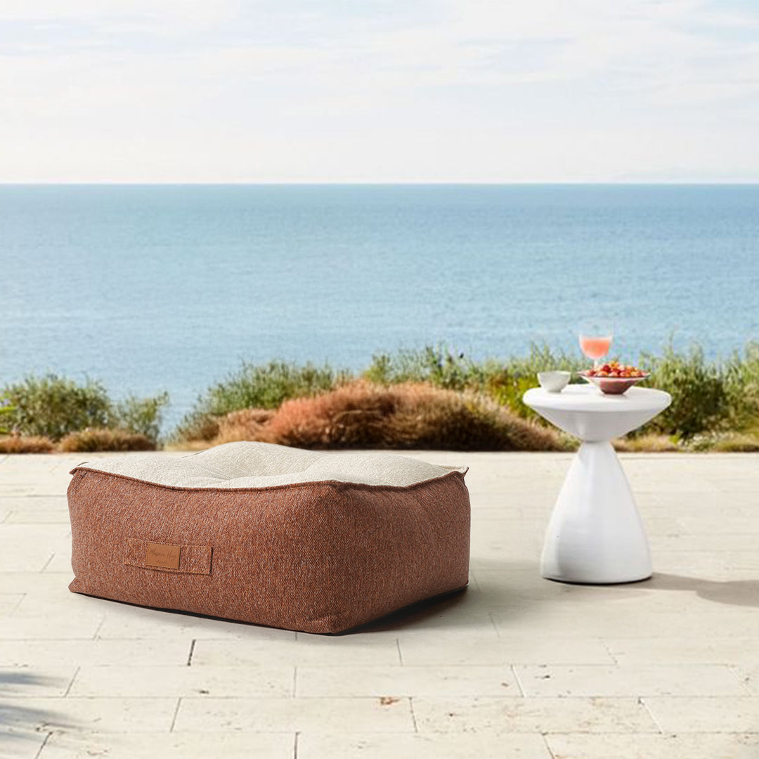 BEACON olefin pouf 552/545-BB in neutral fabric, round and plush, perfect for casual seating in living rooms or bedrooms.