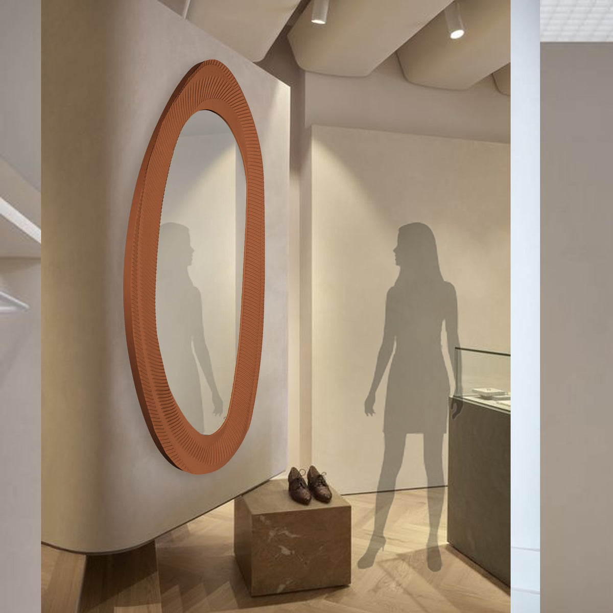 Onda Wall Mirror with a brushed caramel frame from BEACON, showcasing a sleek, modern design for stylish home decor.