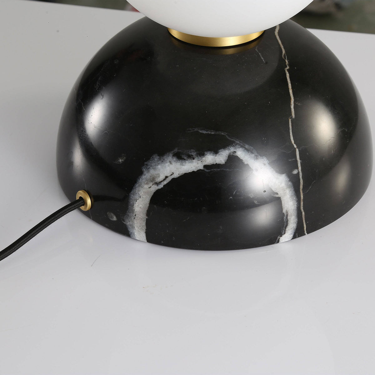 BEACON black marble base table lamp with opal glass shade, modern desk or table lighting with sleek design.