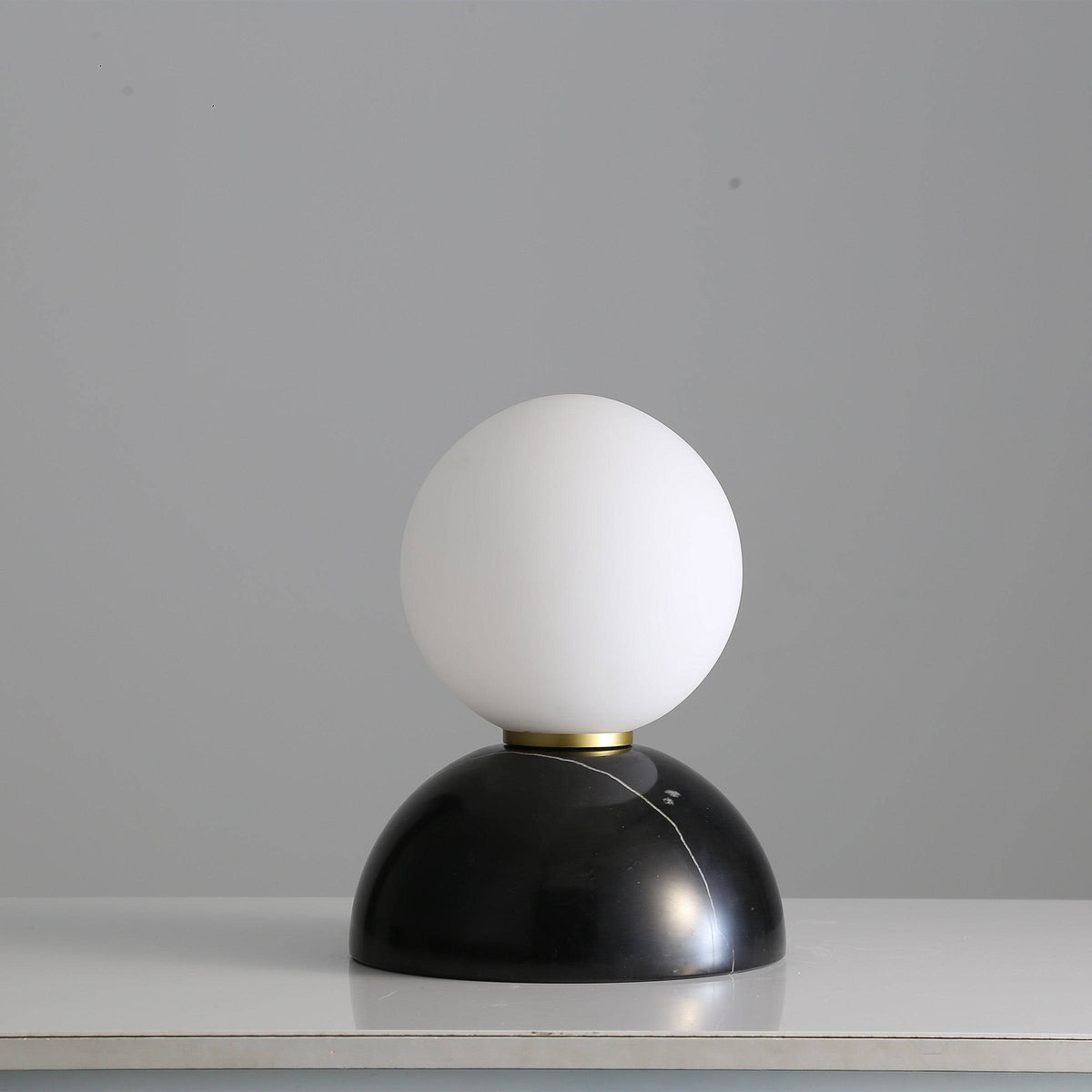 BEACON opal glass shade table lamp with black marble base, ideal for desk or table lighting.