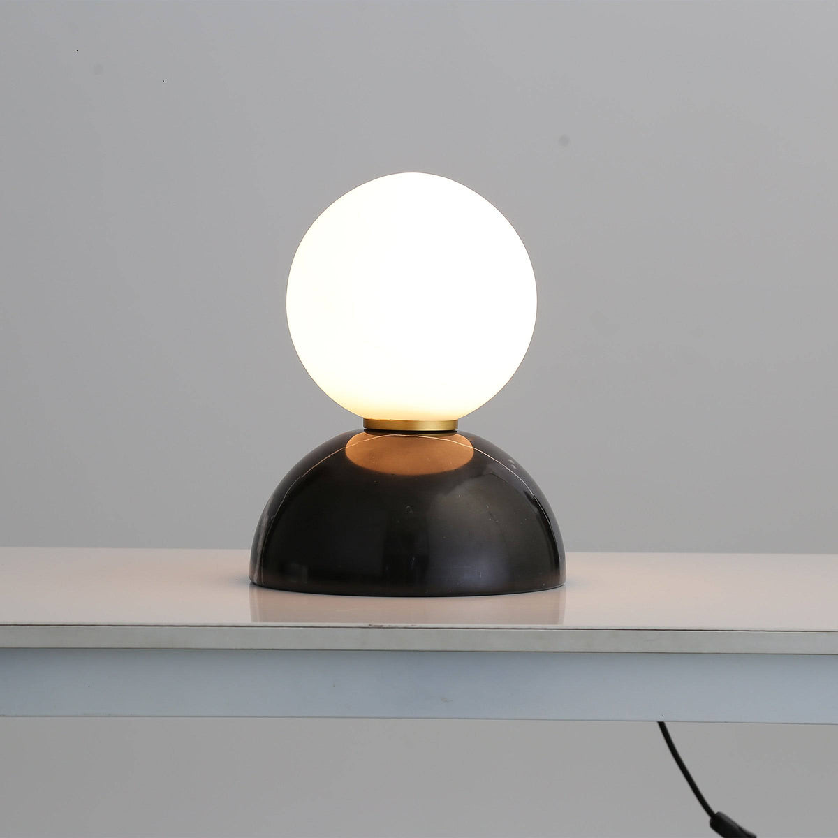 BEACON black marble base desk lamp with opal glass shade, modern table lamp for stylish home or office lighting.
