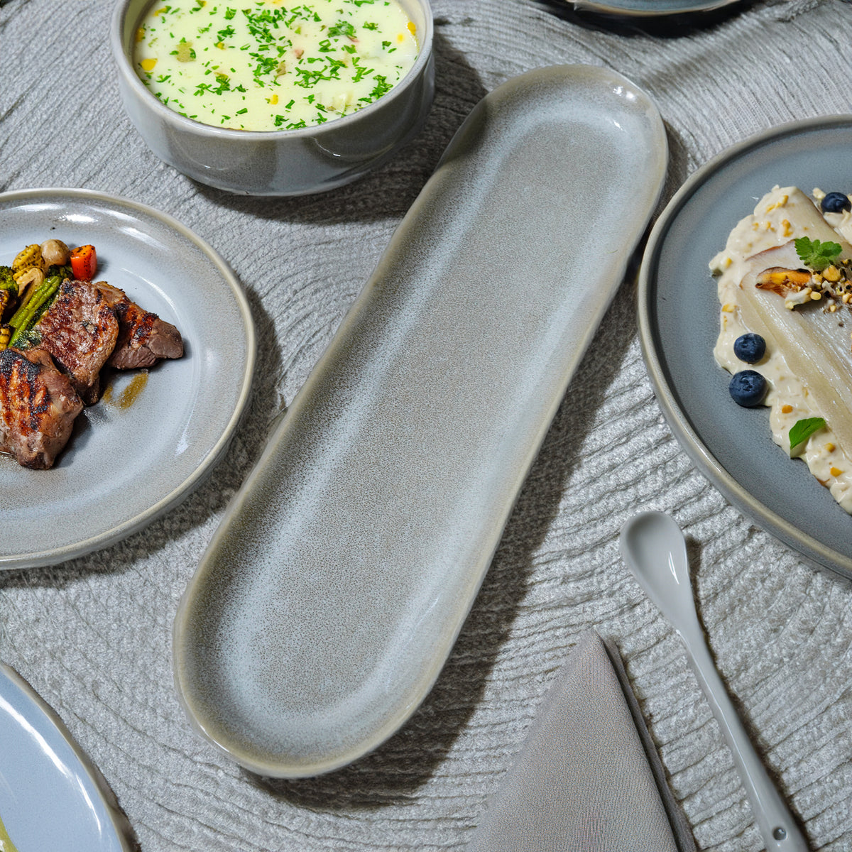 Gray Passifoy long plate tray by BEACON, ideal for serving or display, featuring a sleek, modern design and durable material.
