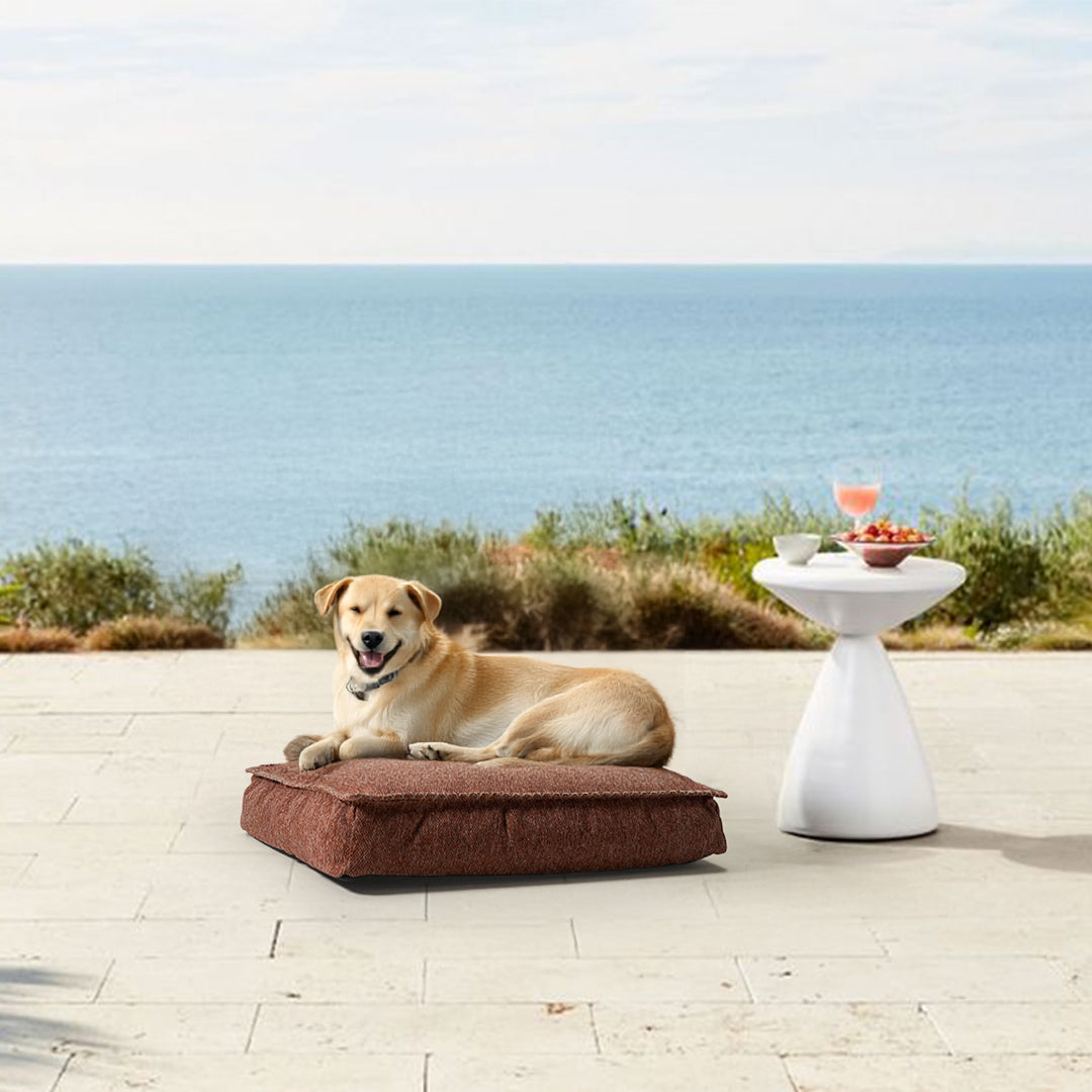 Large orange BEACON pouf pet bed, soft and cozy, designed for comfort and relaxation for pets.