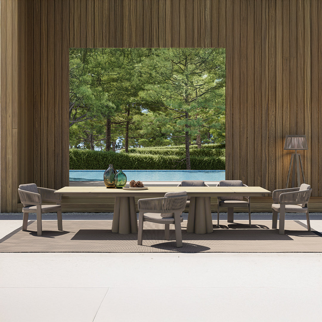 Outdoor extendable dining table by BEACON with two extensions, crafted for outdoor use, featuring a sleek wooden design.