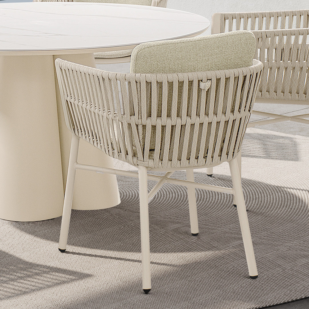 Marrakech outdoor dining armchair by BEACON, featuring woven design and armrests, suitable for outdoor patio seating.