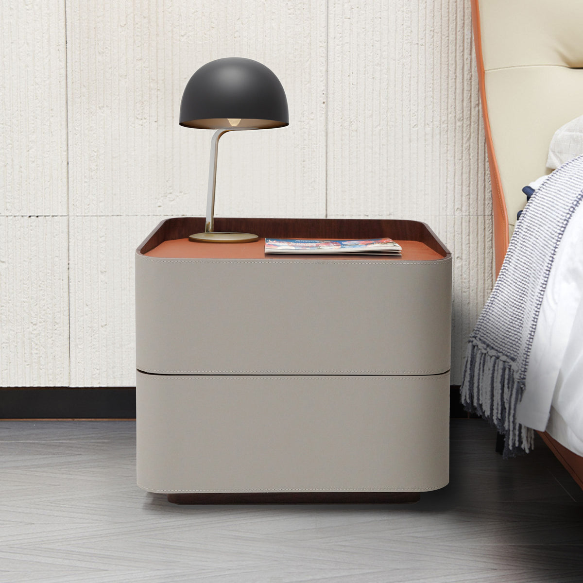 Urban Retreat saddle leather bedside table by BEACON featuring a sleek design, smooth leather surface, and sturdy legs.
