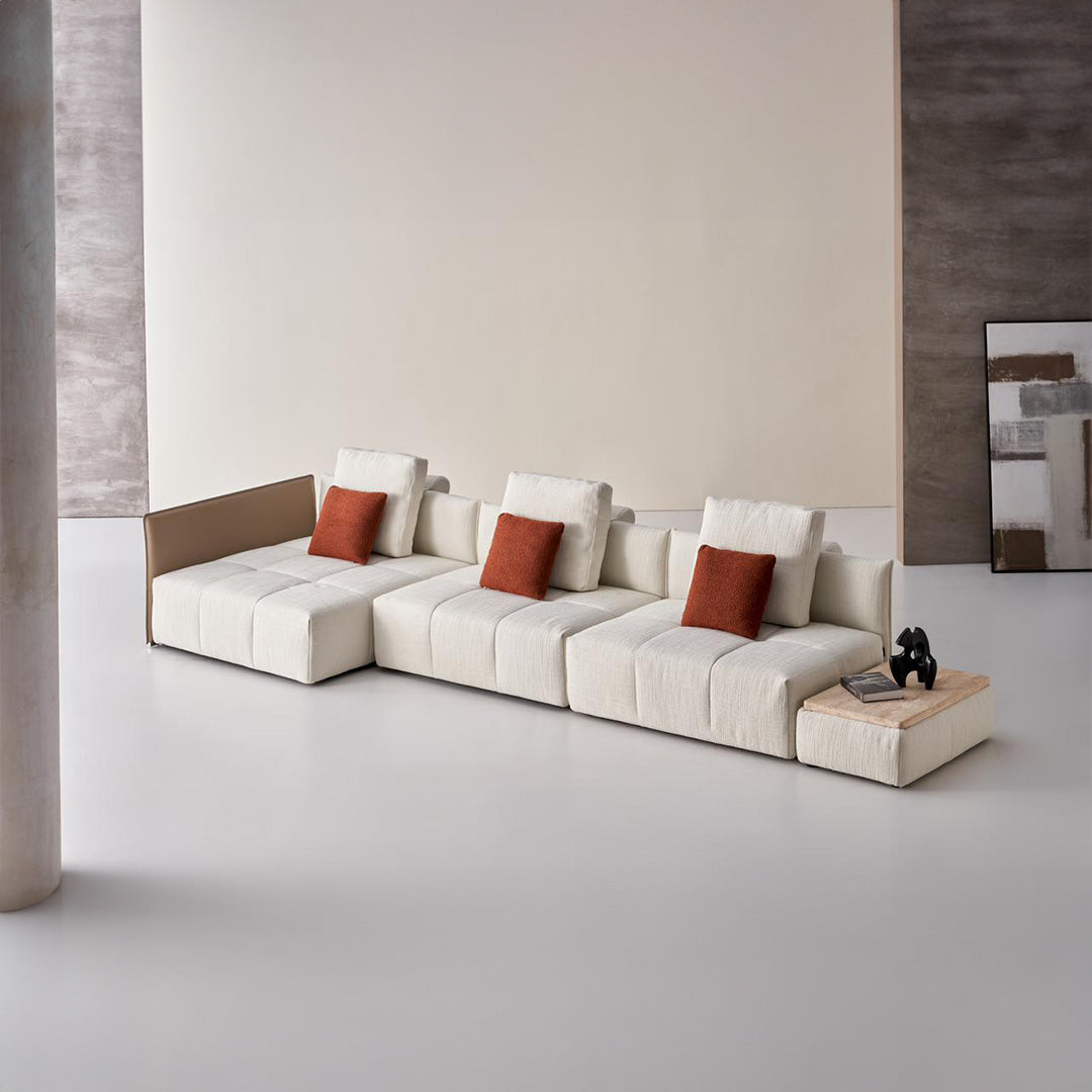 Puzzle modular saddle leather sofa with long metal handrail by BEACON, featuring a contemporary design and plush seating.