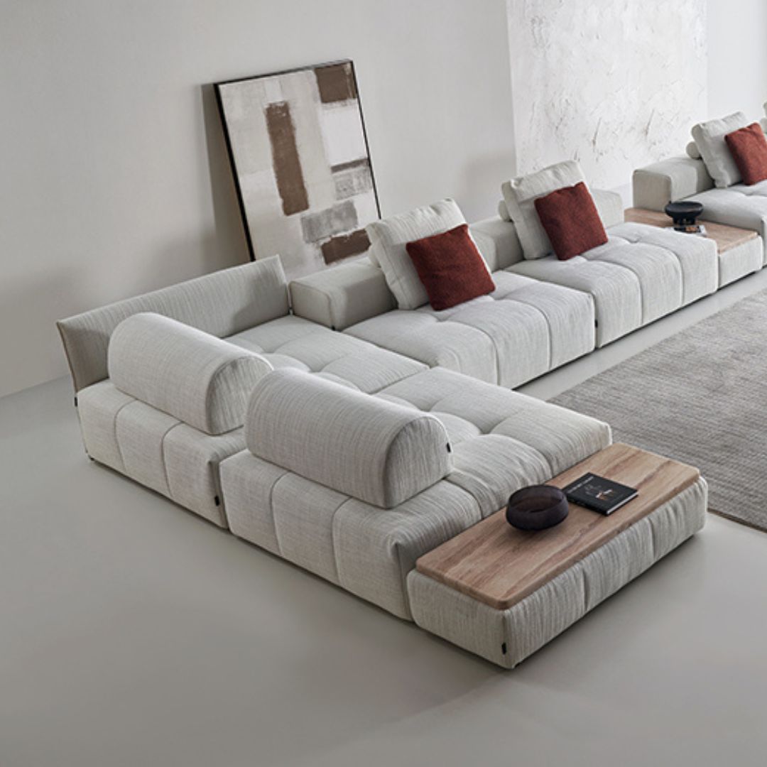 BEACON puzzle triangle removable waist cushion on sofa, showcasing its fabric cover and ergonomic design for comfortable support.
