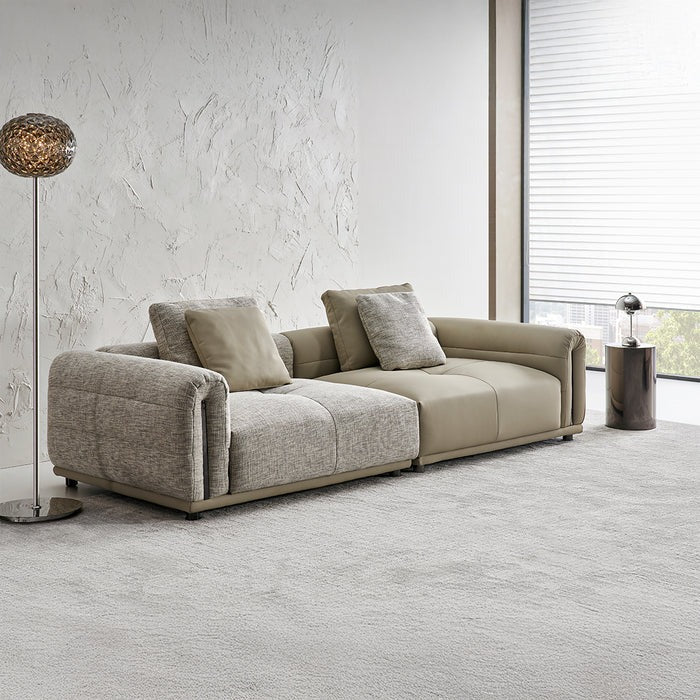BEACON Quadro 2-seater sofa with modern design, upholstered in neutral fabric, shown from a front angle.