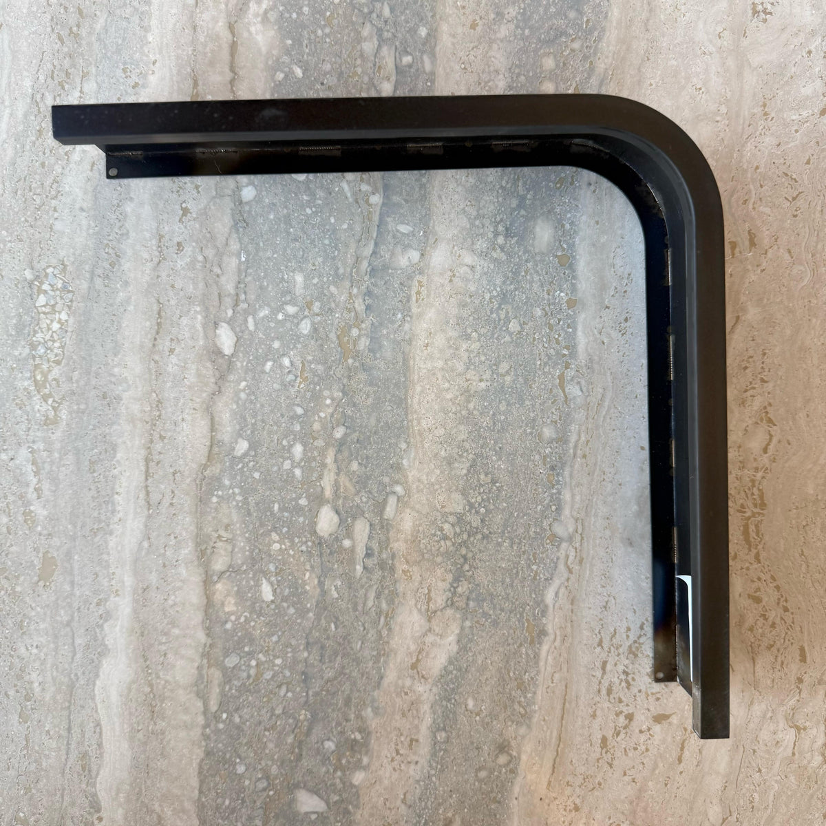 Black R50 6cm external corner skirting accessory by BEACON, designed for wall panel profiles, shown in close-up detail.