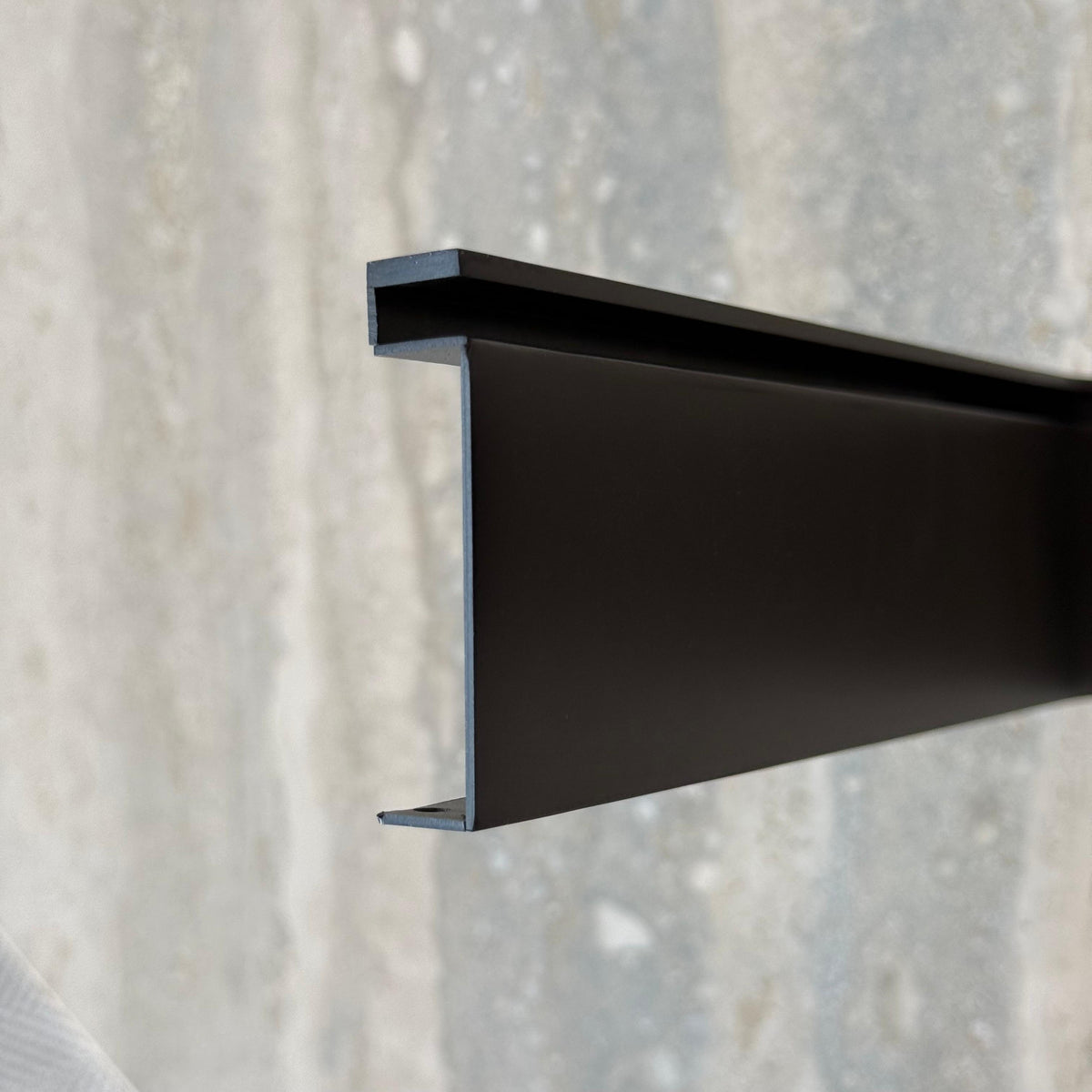 Black R50 6cm internal corner skirting accessories by BEACON, designed for wall panel profiles in modern interior spaces.