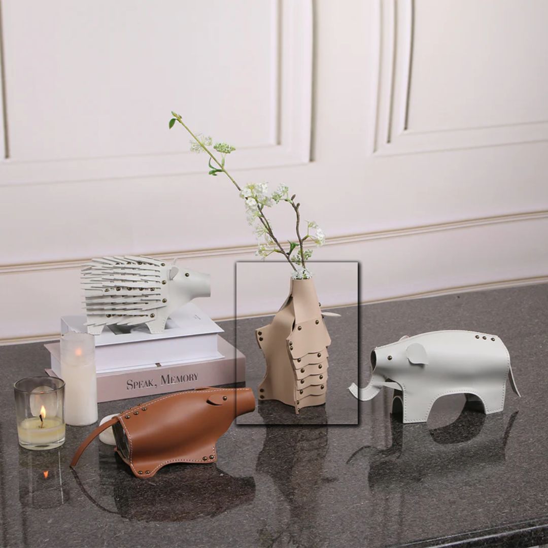 Beige ceramic rhino-shaped vase sculpture with detailed features, designed for decorative display in modern interiors.