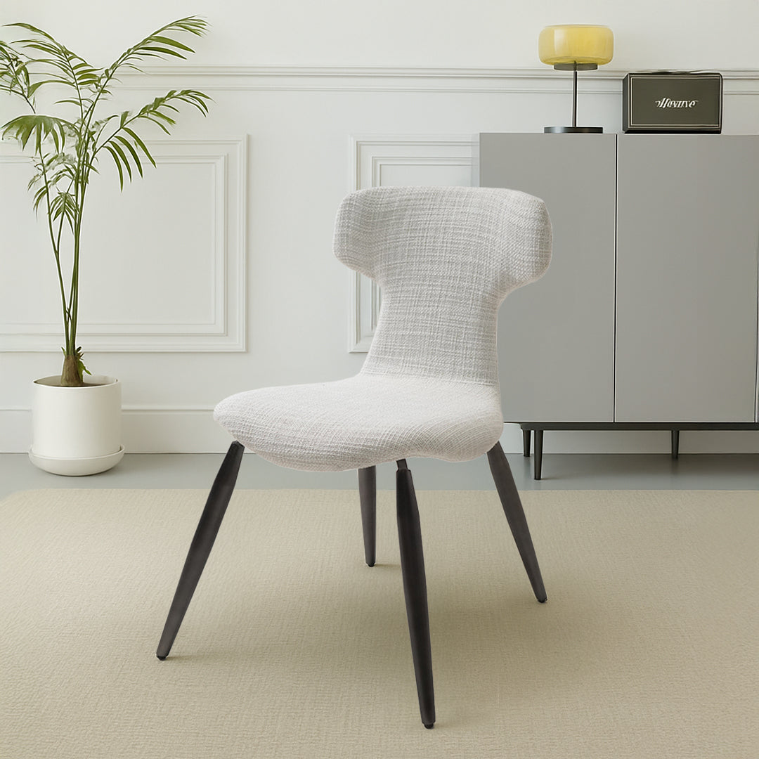Beige Roma chair with black metal legs from BEACON, showcasing a modern, comfortable design perfect for dining or office spaces.