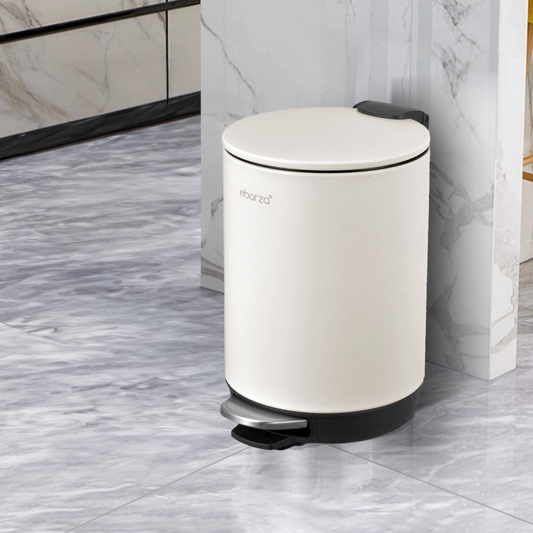 Cream round high basement step trash can from BEACON bathroom accessories, featuring a sleek design for bathroom use.