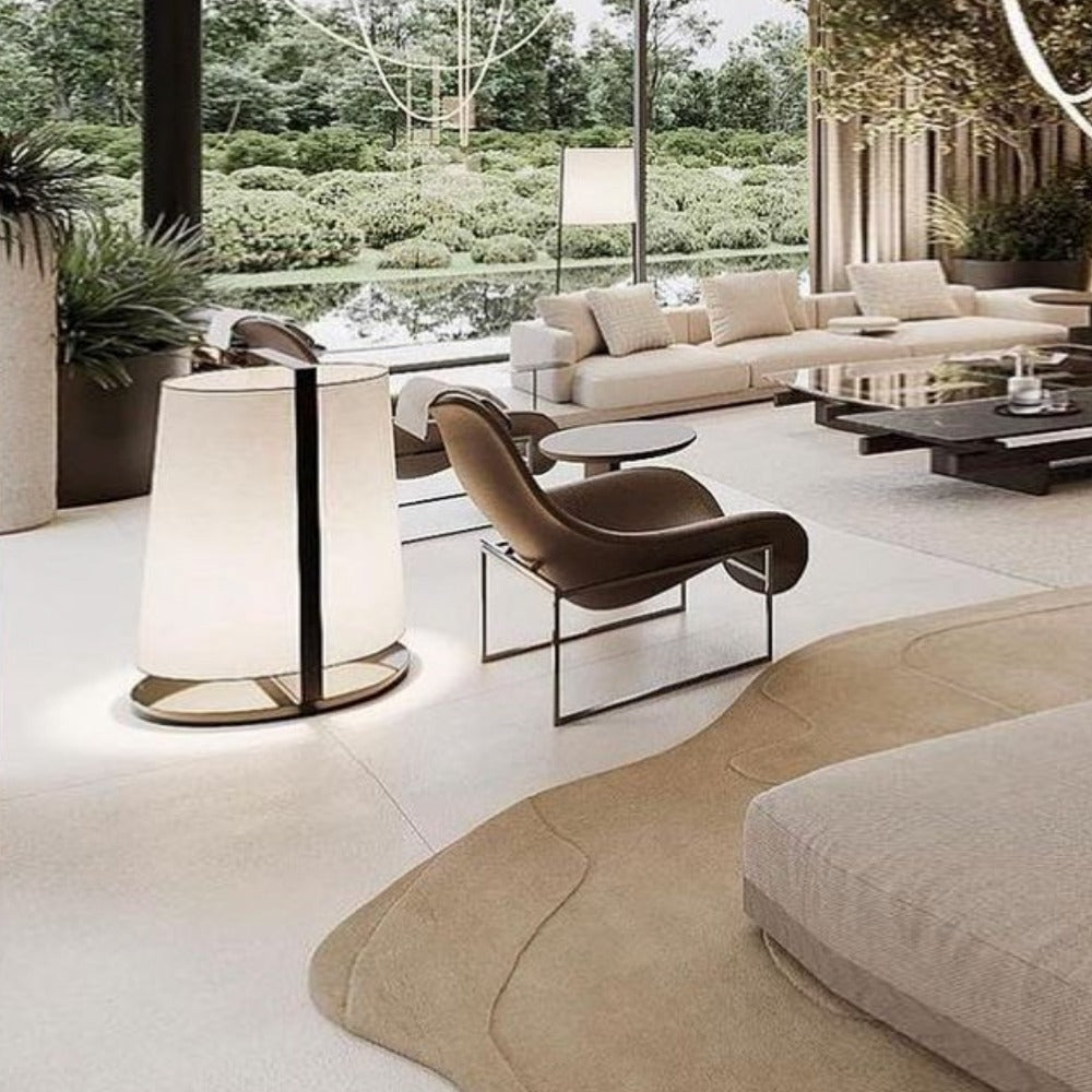 Display saddle leather lounge chair by Beacon, featuring a sleek design with plush cushioning and wooden legs.