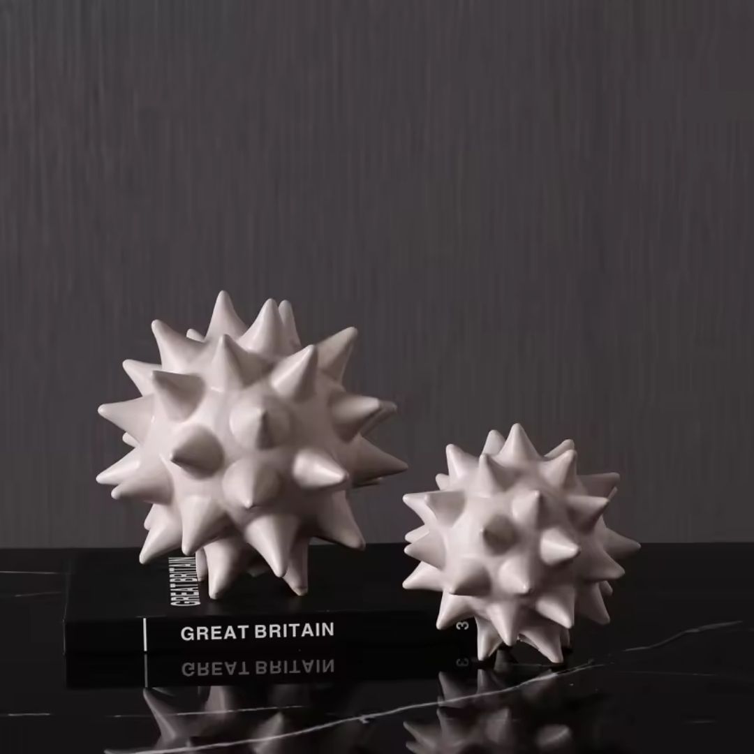 Ceramic sea urchin ball decorative figurine by Beacon, modern home decor piece with intricate textured design.