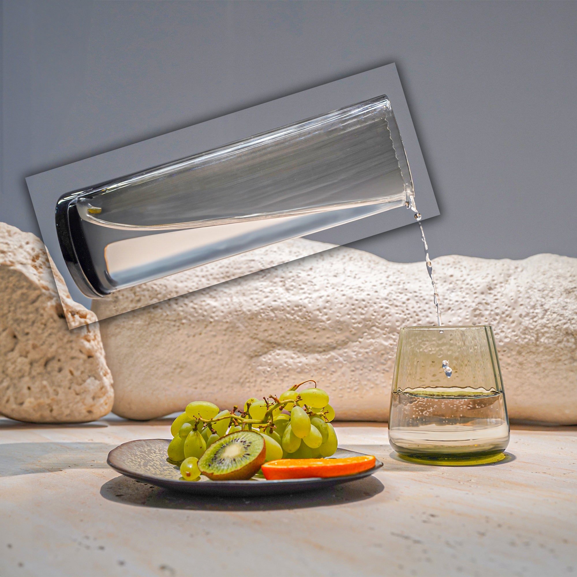 Smoked grey BEACON 1.2L glass carafe for drinks, with a sleek, modern design and wide mouth for pouring and serving beverages.