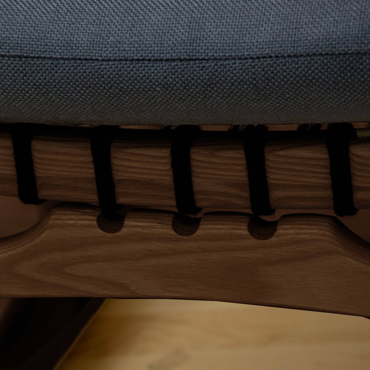 Solid wood and cord lounge chair by RUDI, model SF-019A-W, showcasing a modern design with wooden frame and woven cord seating.