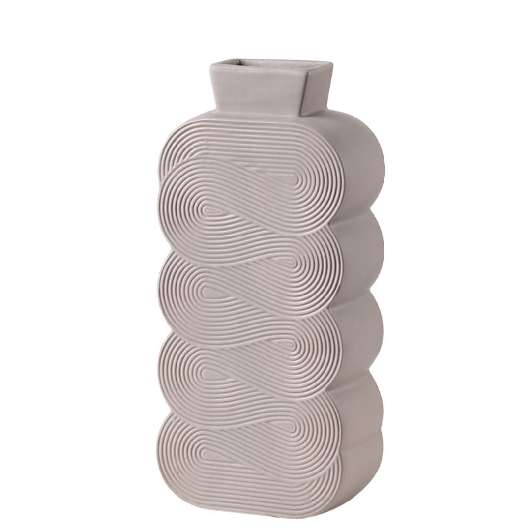 Spiral pattern ceramic vase by BEACON featuring a sleek design, ideal for decorative floral arrangements or modern home decor.