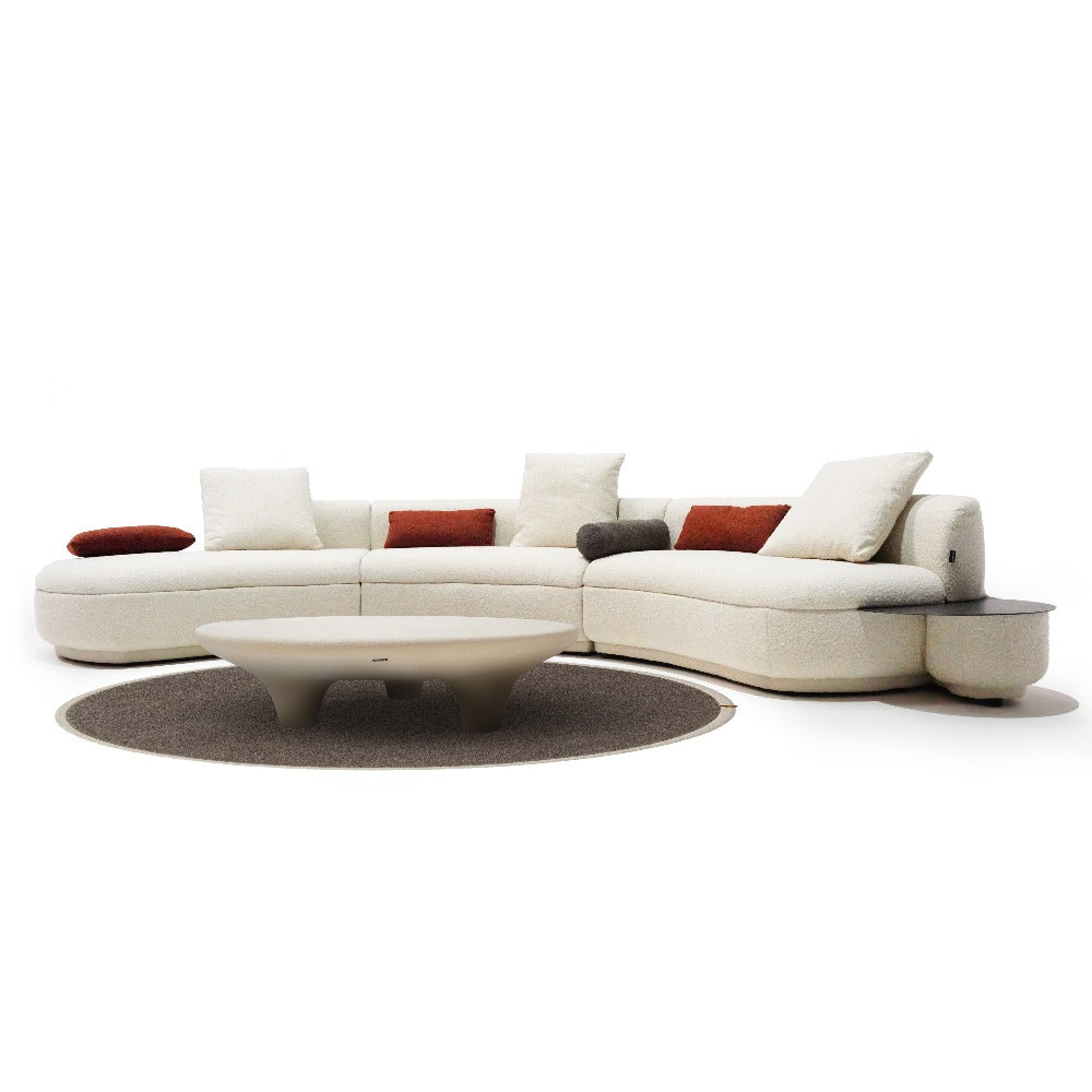 BEACON Teddy Curved Sofa with Side Table, modern living room furniture, plush fabric, and sleek design.