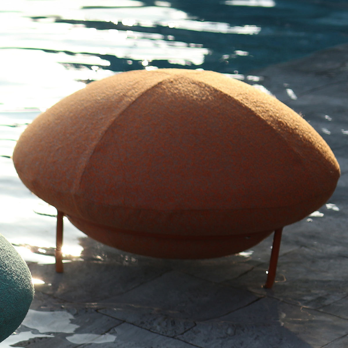 Orange UFO outdoor big stool by BEACON, sturdy plastic outdoor chair suitable for patio or garden seating.