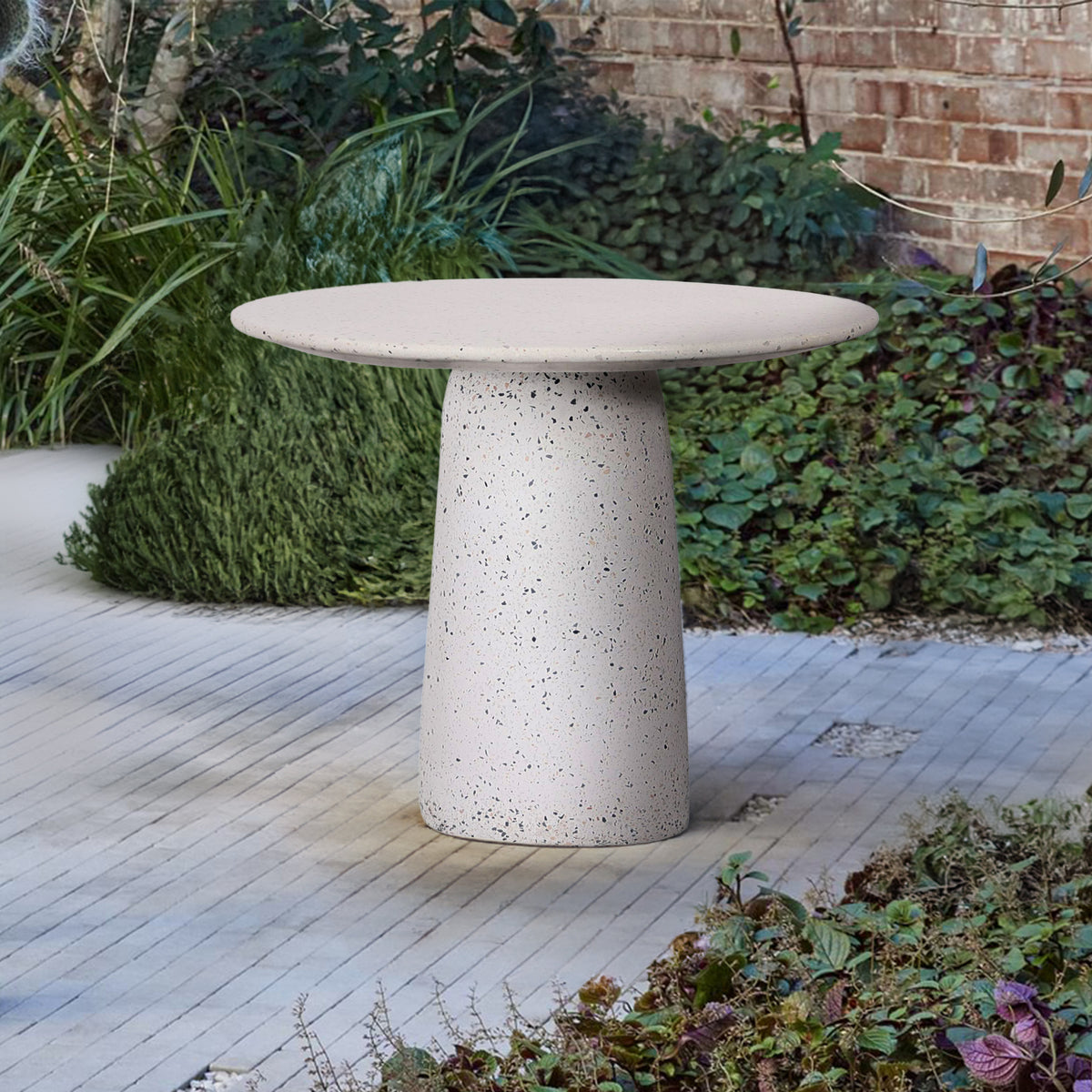 White terrazzo dining table by BEACON with a sleek modern design, suitable for contemporary dining rooms.